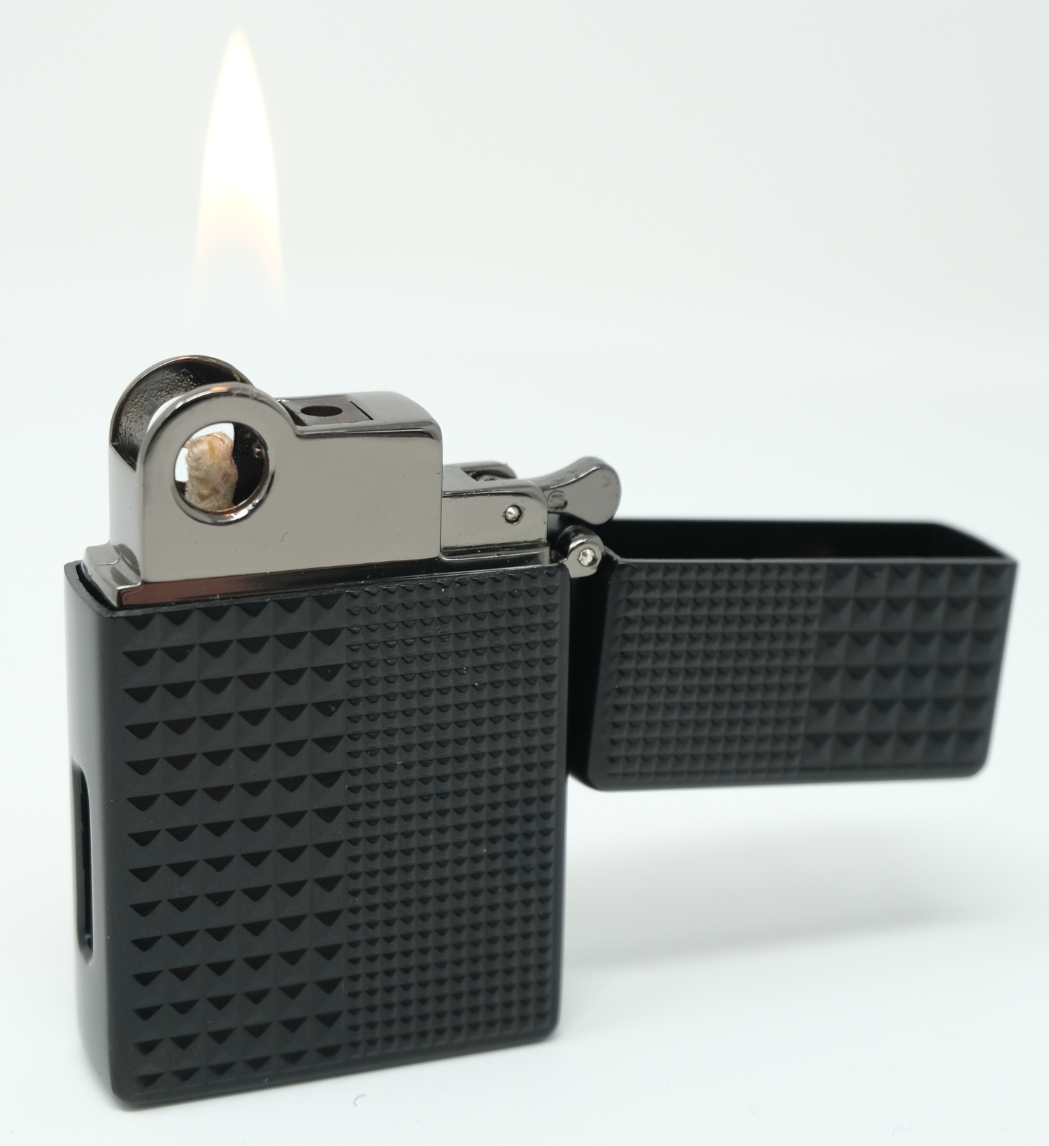 Magic Lighter open with a lit soft flame against a light background
