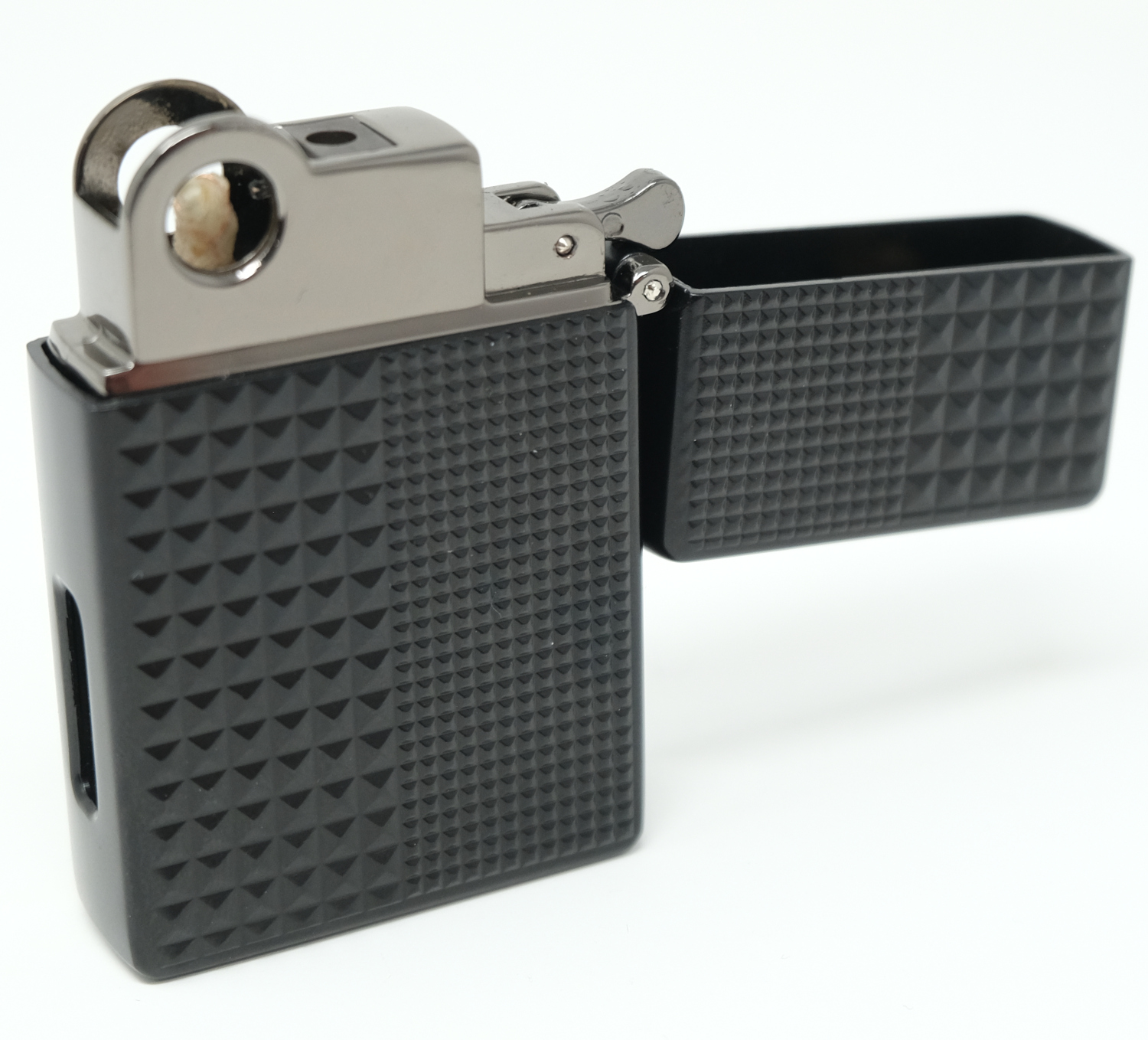 Magic Lighter flipped open showing the gunmetal insert and hinged lid